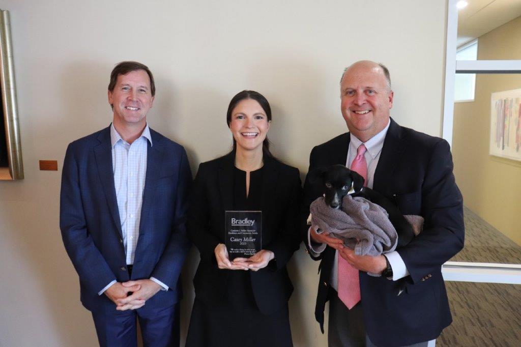 Casey Miller with Jon Skeeters and John Perry receiving the 2023 Cam Miller Award for Excellence and Community Service