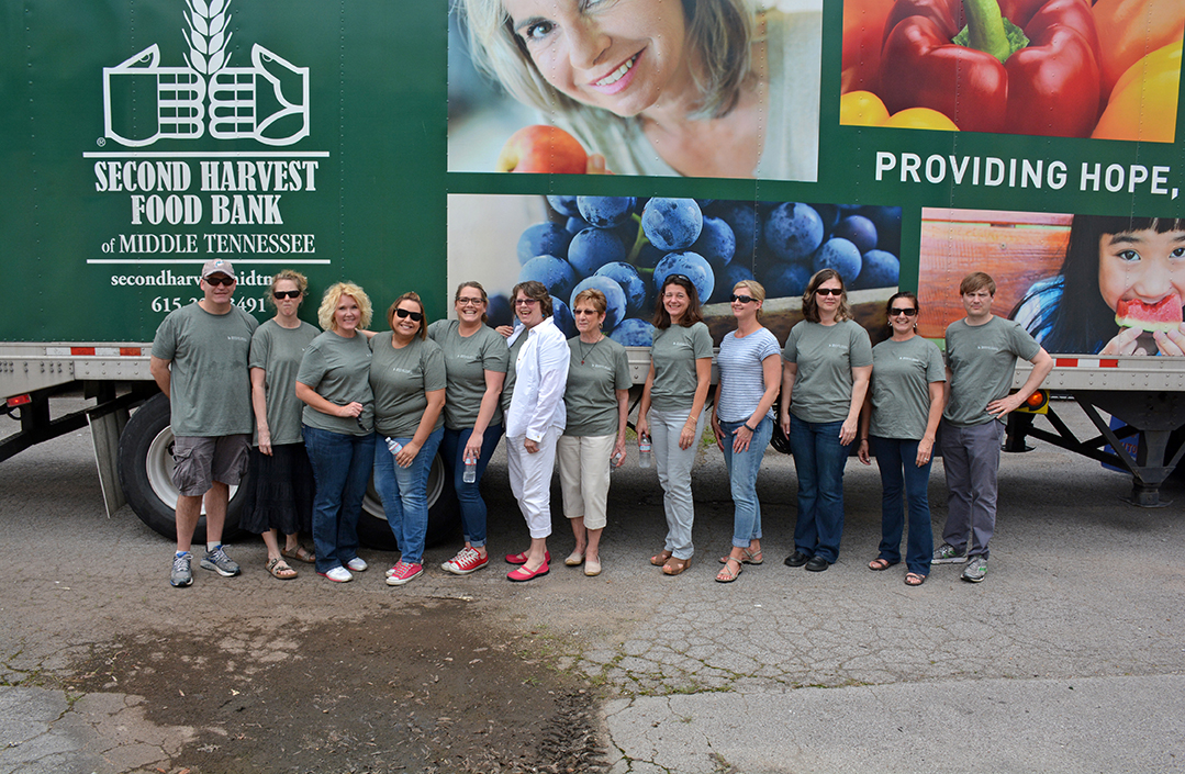 BABC attorneys and staff pose in front of the 18-wheeler truck full of full of food to be distributed at the Second Harvest Food Bank Mobile Pantry in June. Pictured: Peter Sales, Erika Uhrlass, Louanne Staff, Sarah Blish, Ashleigh Swaggerty, Patsy Duffer, Sandy Naples, Lela Hollabaugh, Deborah Longbotham, Stacey Vogler, Suzanne Stephens, Frankie Spero